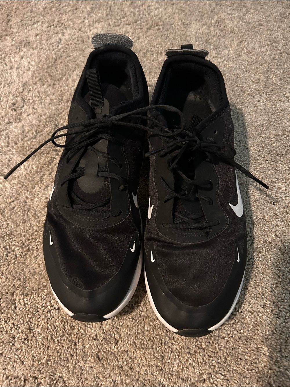 Nike Black Sneakers with White Swoosh Accents